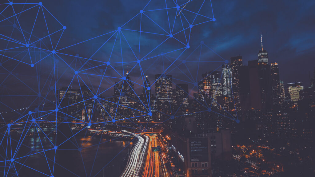 Nighttime skyline with a digital network overlay symbolizing AI-powered, networked document management